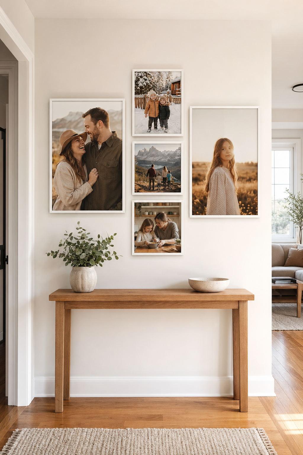 Gallery wall of five vertical canvas prints in coordinating sizes displayed in a bright modern Canadian home hallway